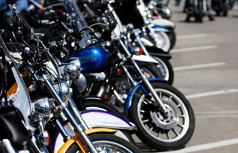 Motorcycles lined up on a street in Sturgis SD